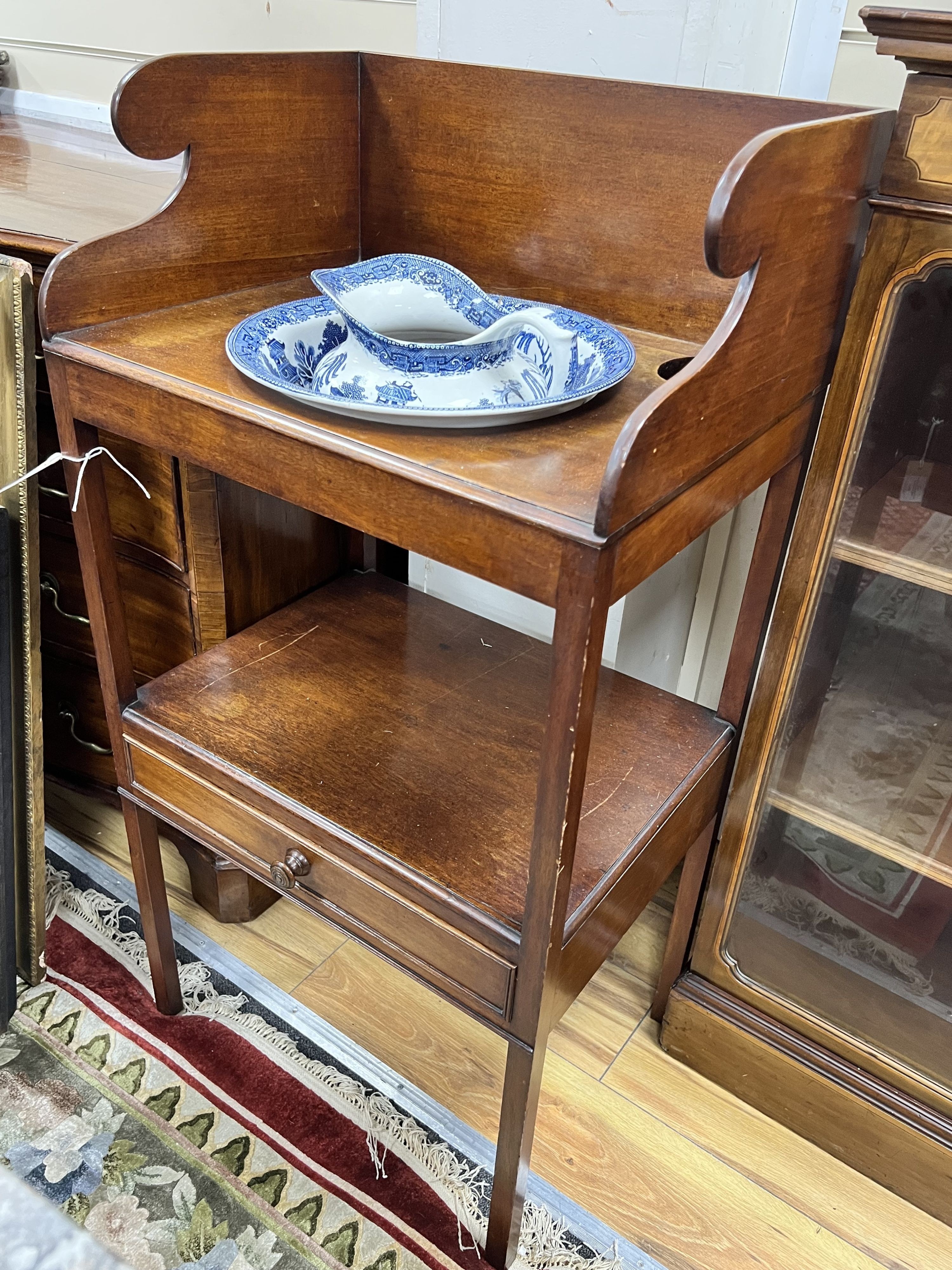 A Regency mahogany two tier washstand, together with a Staffordshire blue and white jug and basin, width 50cm depth 38cm height 101cm